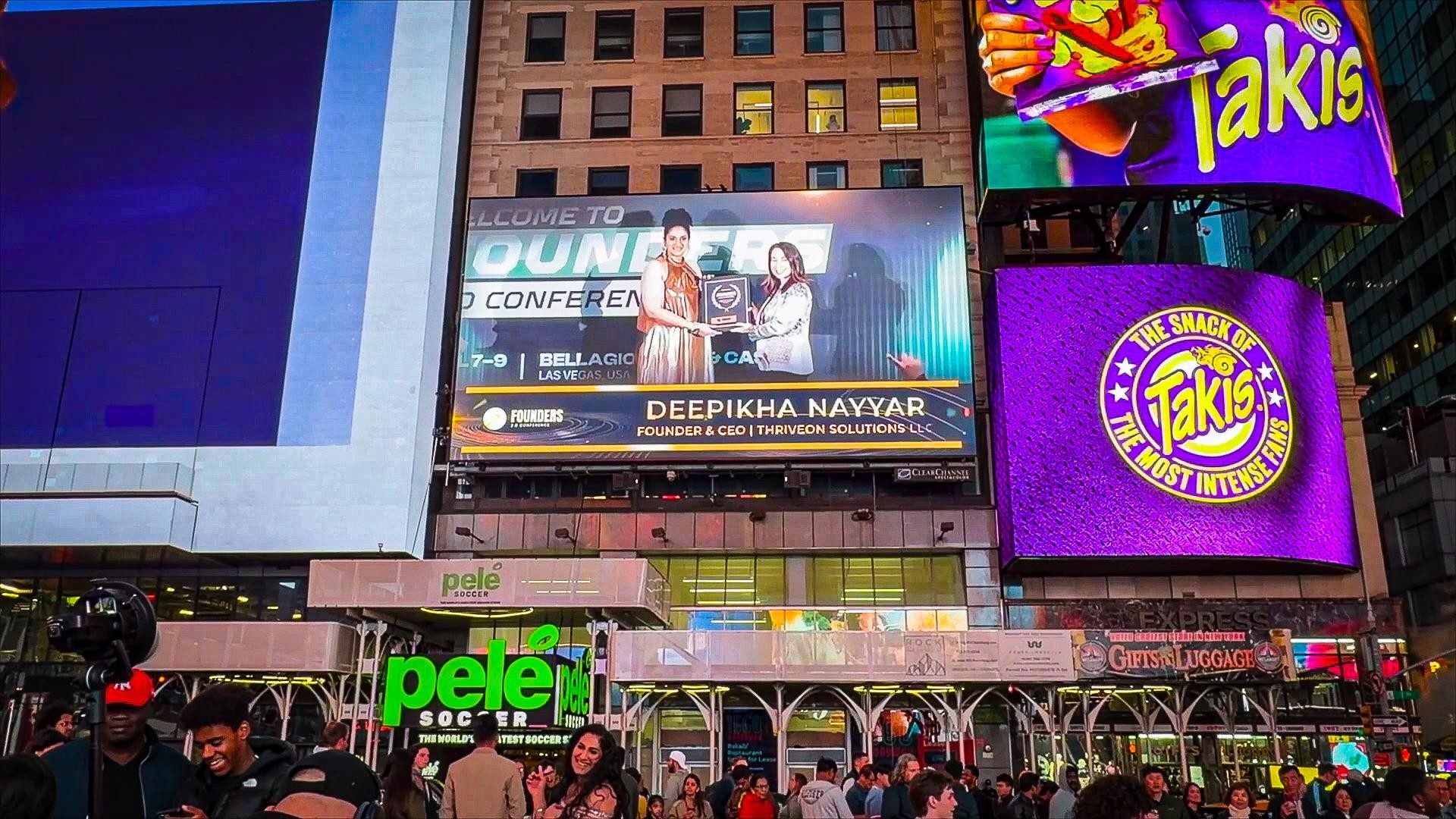 Deepikha Nayyar, Founder and CEO of ThriveOn Solutions, featured on a New York Times Square billboard
